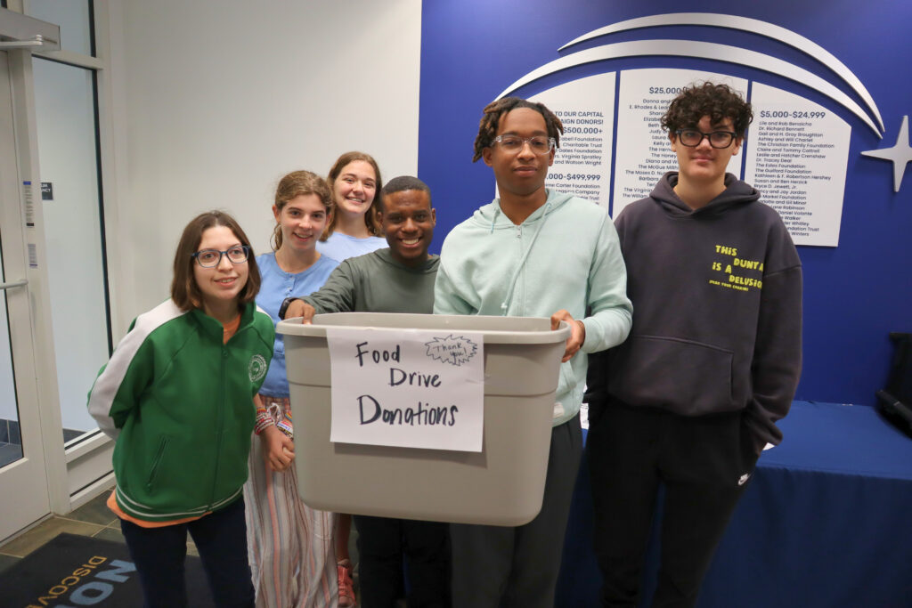 Ms. Lynch's Advisory class collects donations for a food drive.