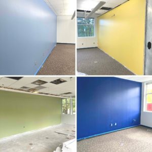 Shades of blue, yellow and green paint on classroom walls. 