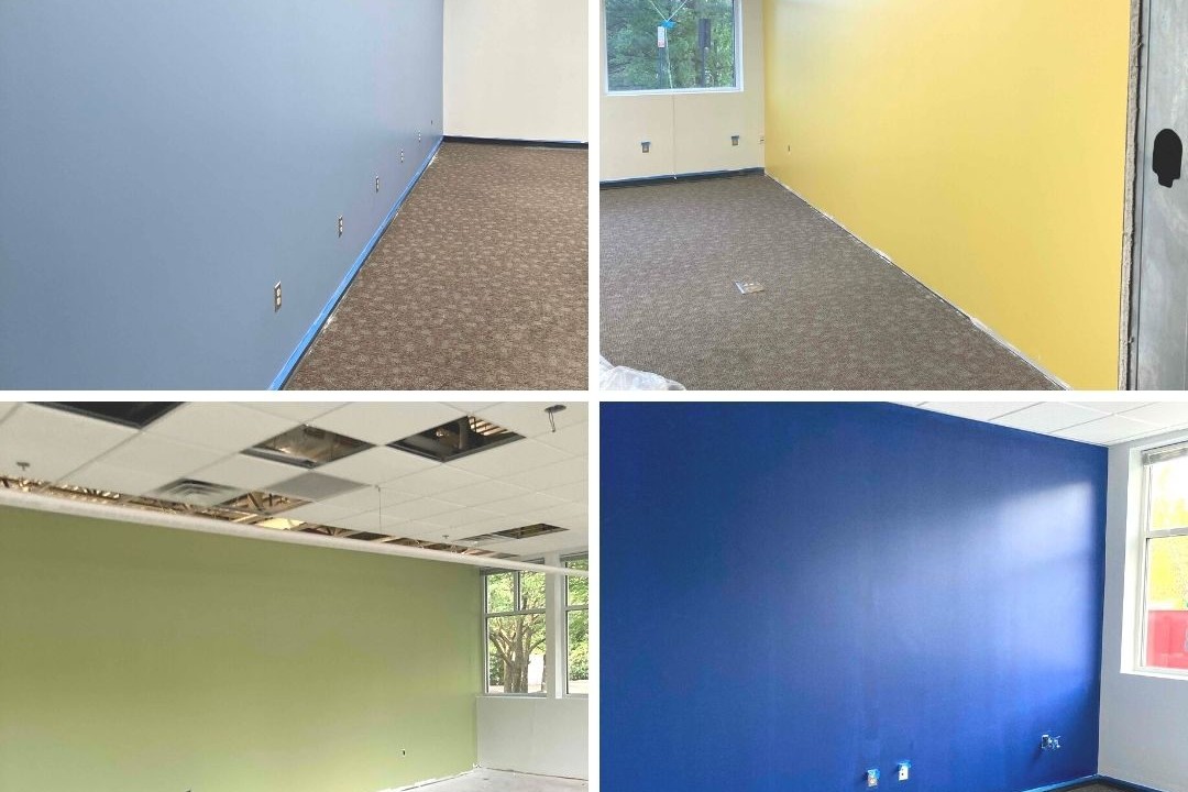 Shades of blue, yellow and green paint on classroom walls.