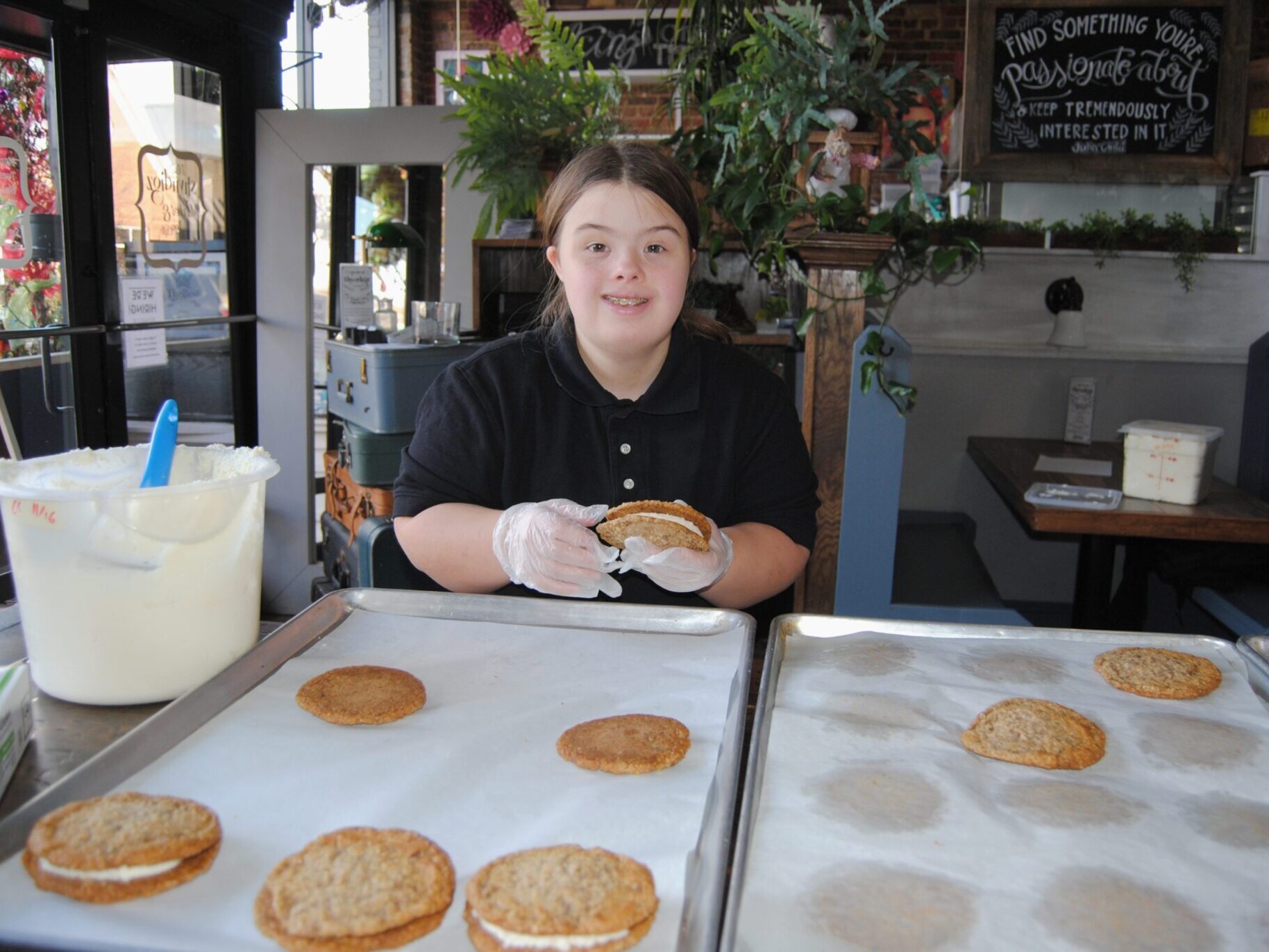 student smiling at camera holding oatmeal cream pie