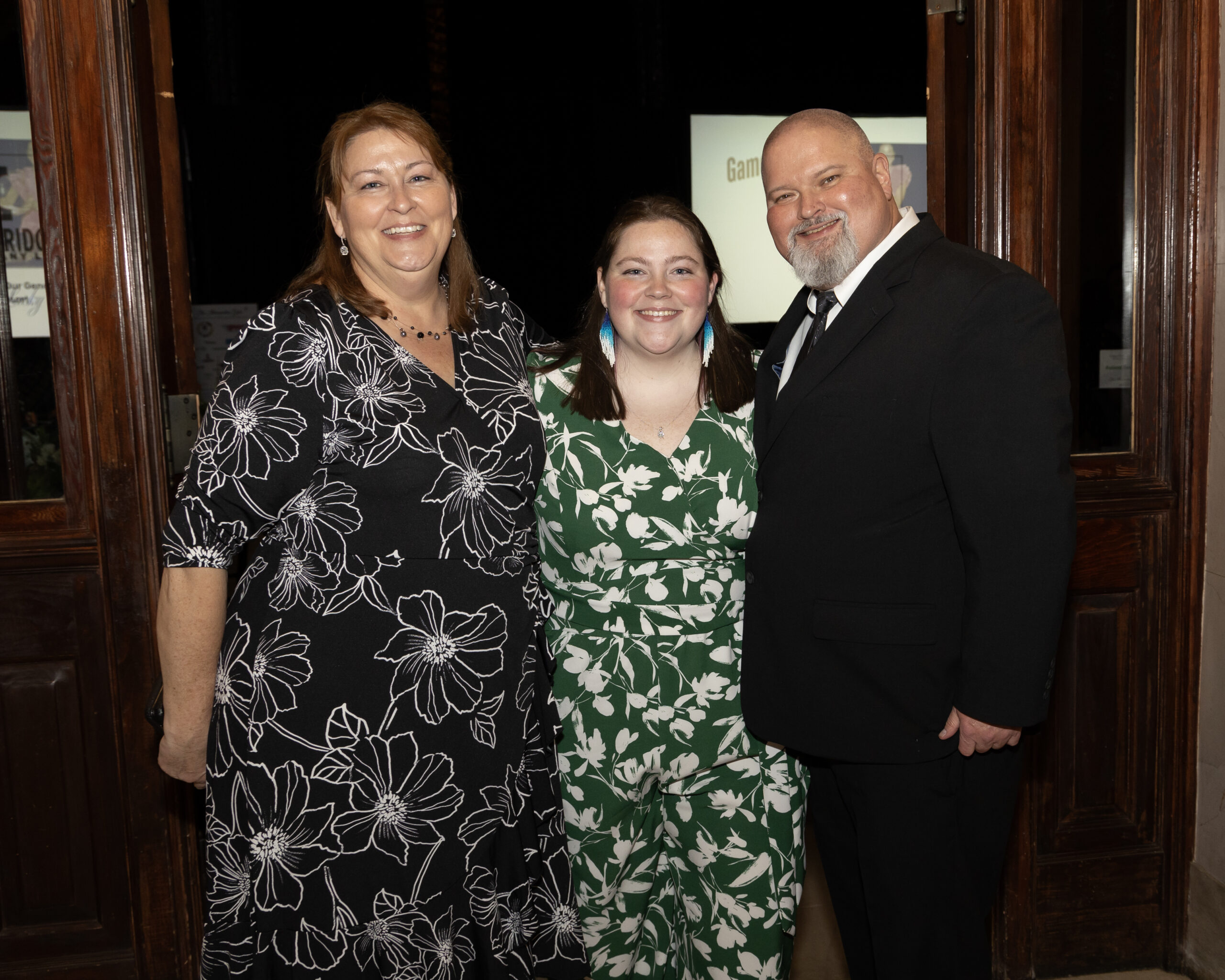 A smiling family poses for a photo at the Gala.