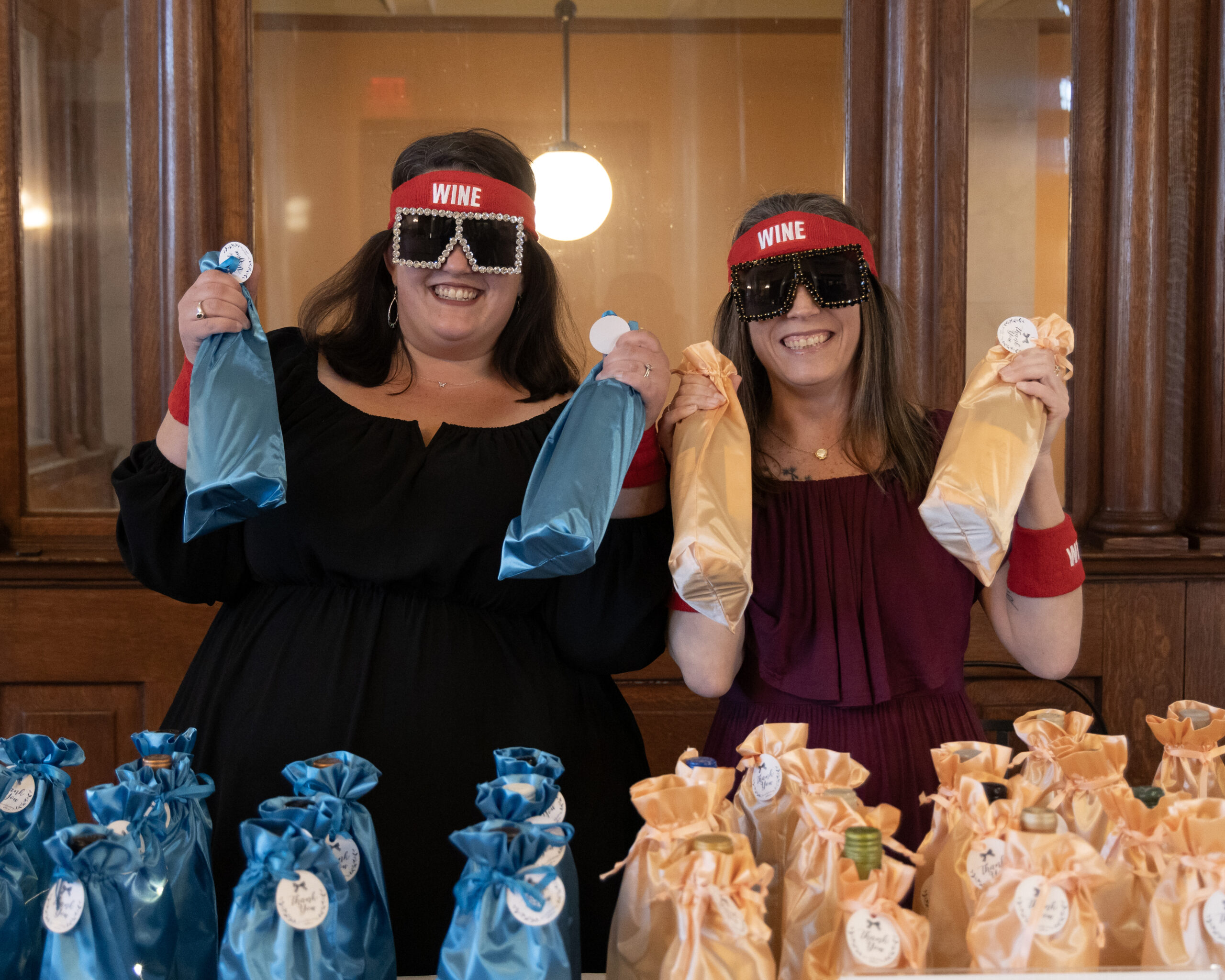 Volunteers sell bottles at the Wine Pull table.