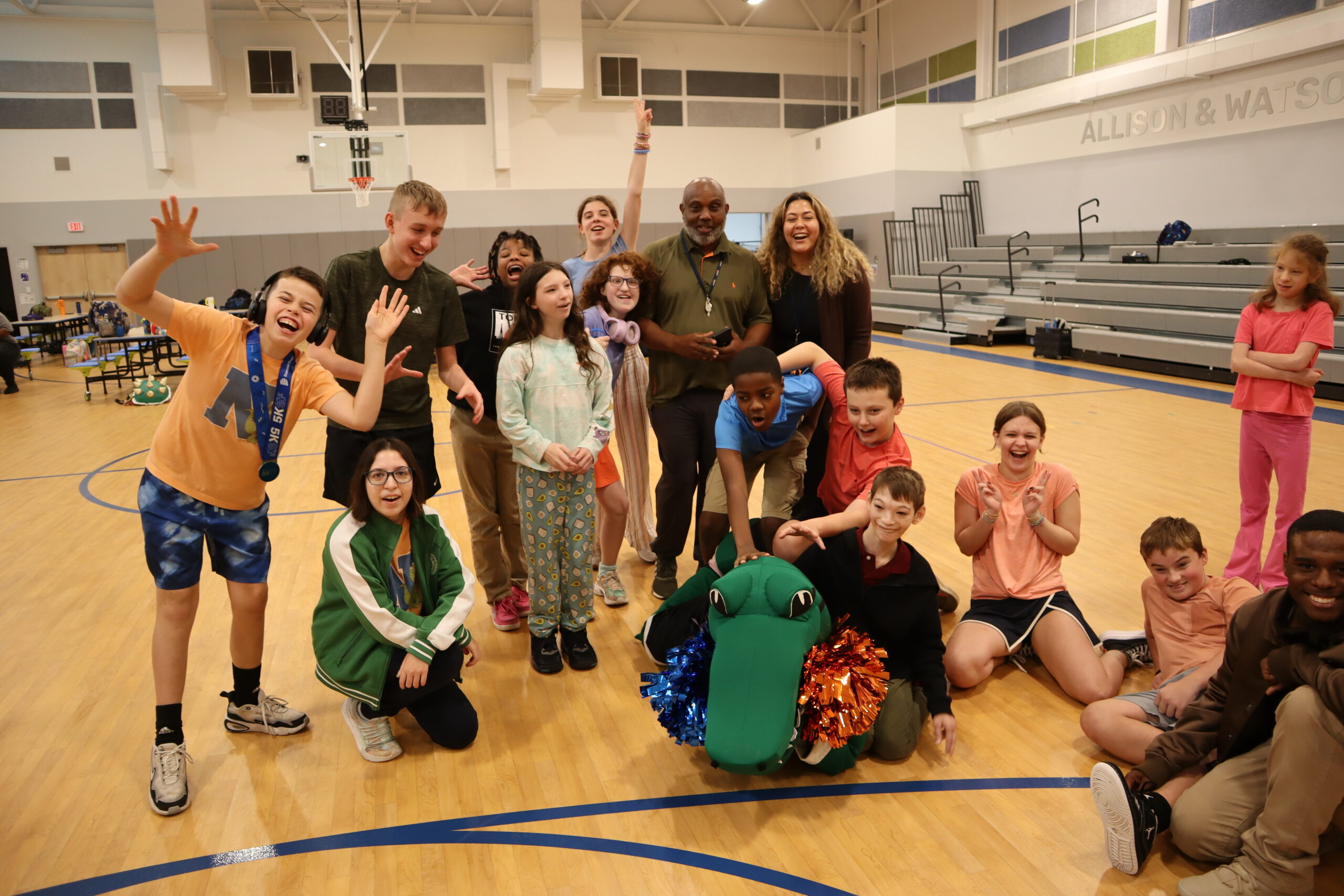 A group of students post with Northstar's mascot Navi the Gator.