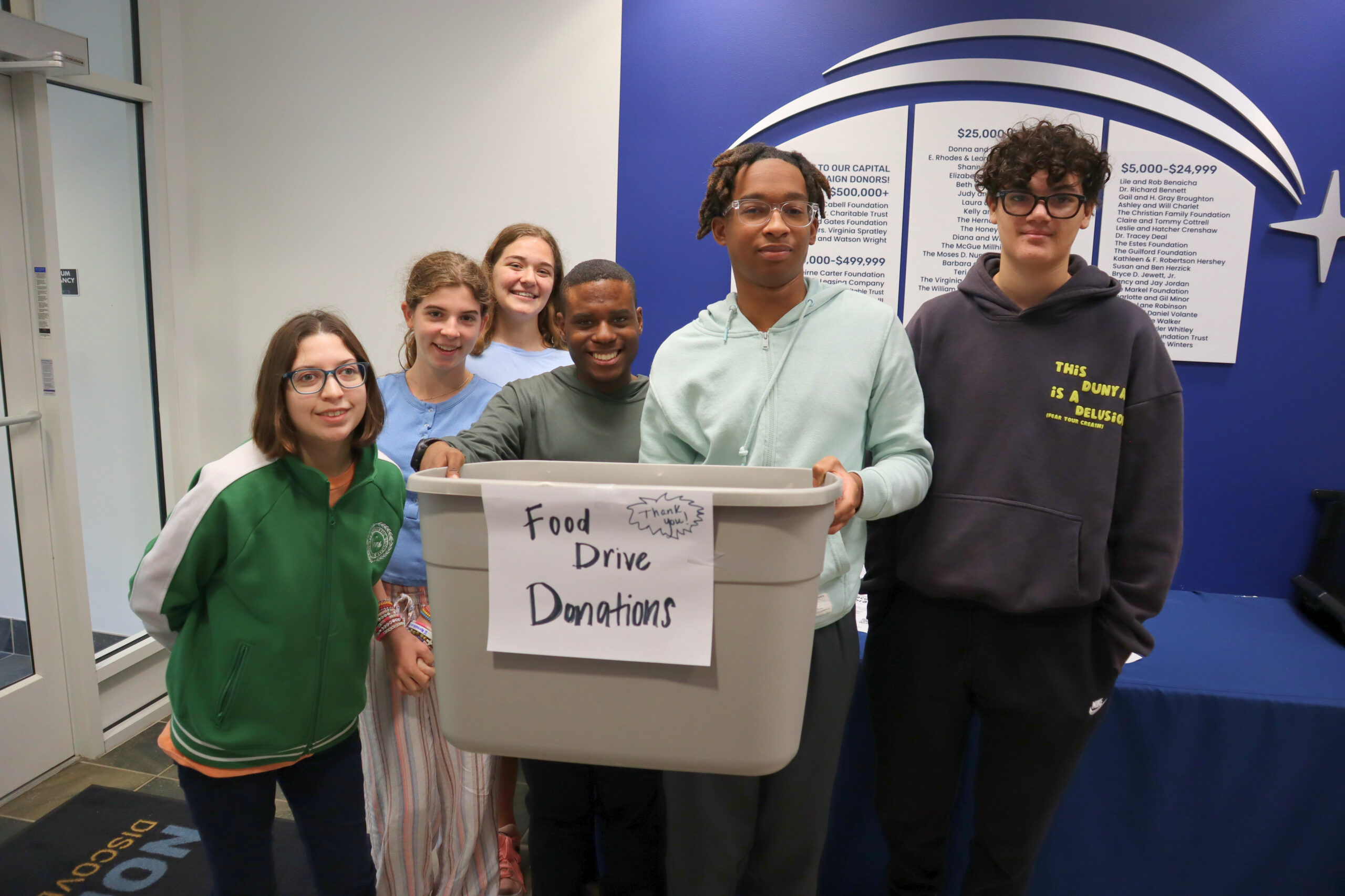 Ms. Lynch's Advisory class collects donations for a food drive.