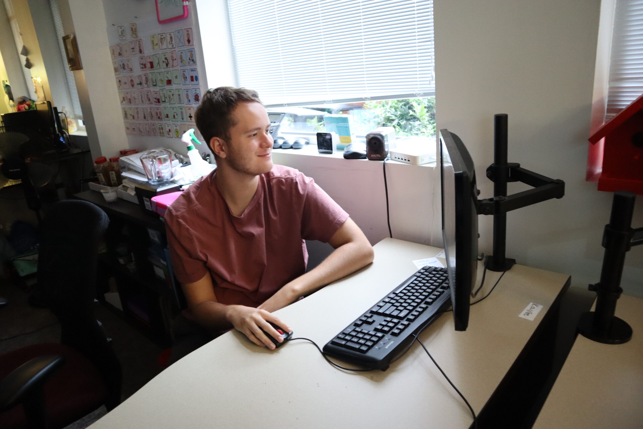 A Business Technology student works on a computer.