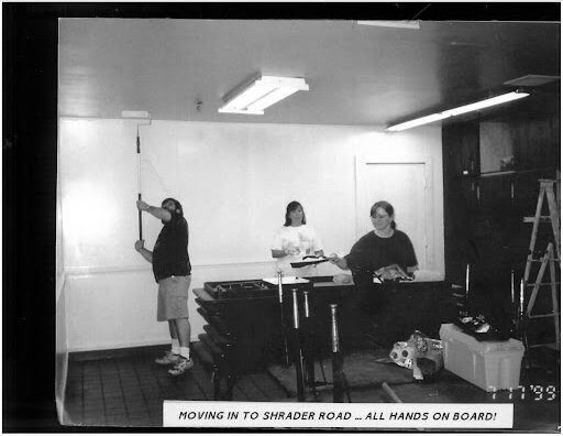 Painting the Train Cars Black & white photo of parents painting train cars.