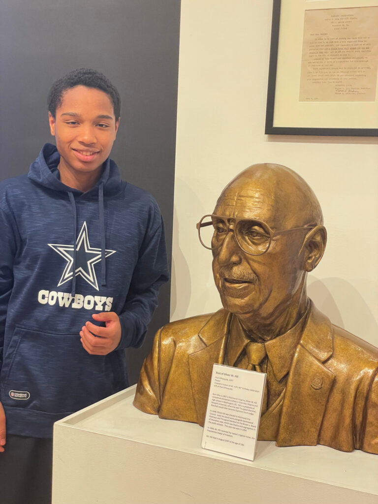 Student with Hill Bust Student with a bust of civil rights attorney Oliver Hill.