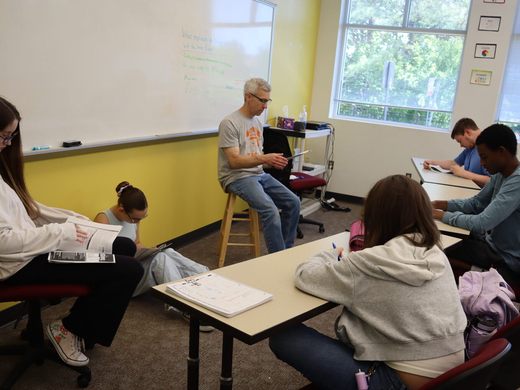 Upper School English students read together as a class.